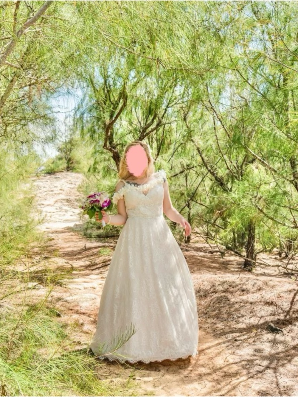 Elegant Ivory Lace Wedding Dress with spaghetti straps and train.